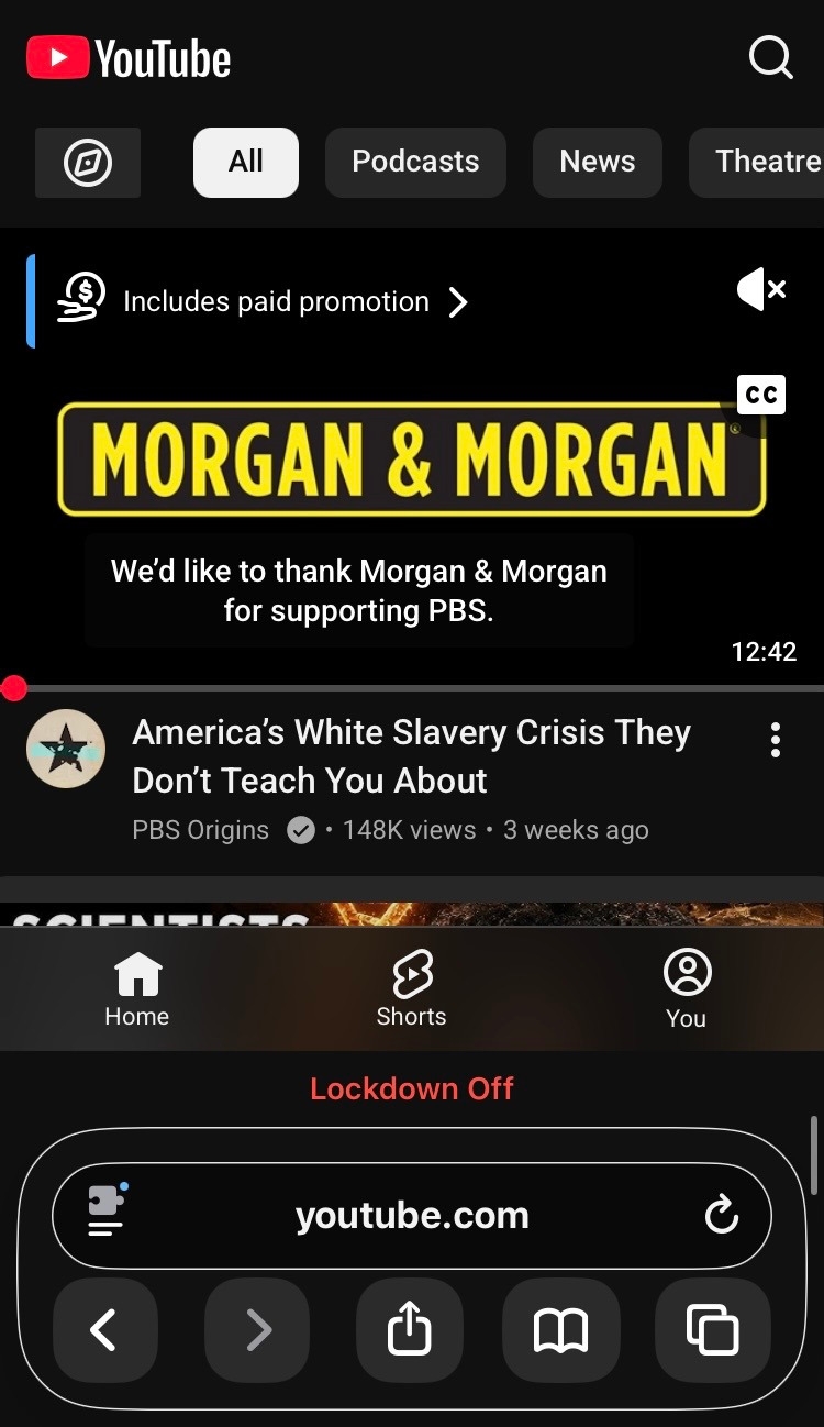 Mobile screenshot of YouTube home feed focused on a video from PBS Origins, titled: 'America's White Slavery Crisis They Don't Teach You About'. Video preview has started and displays yellow 'Morgan & Morgan' on a black background, with captions saying 'We'd like to thank Morgan & Morgan for supporting PBS'. A pop-up at the top left says 'Includes paid promotion'. The video was posted three weeks ago and has 148k views.  